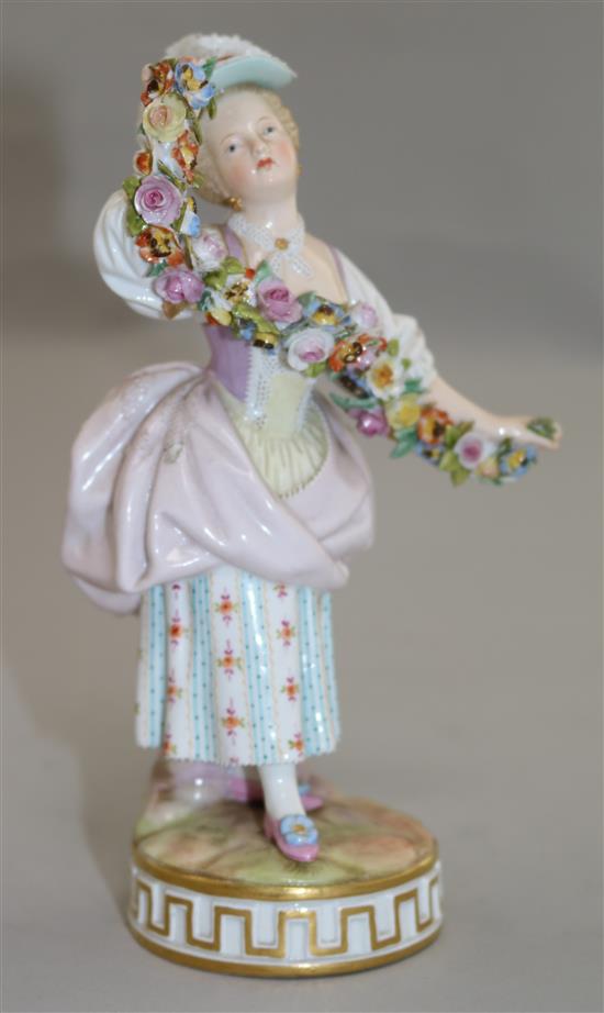 A Meissen figure of a lady holding a garland of flowers, late 19th century, 17cm